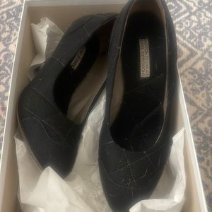 Acme black quilted pumps